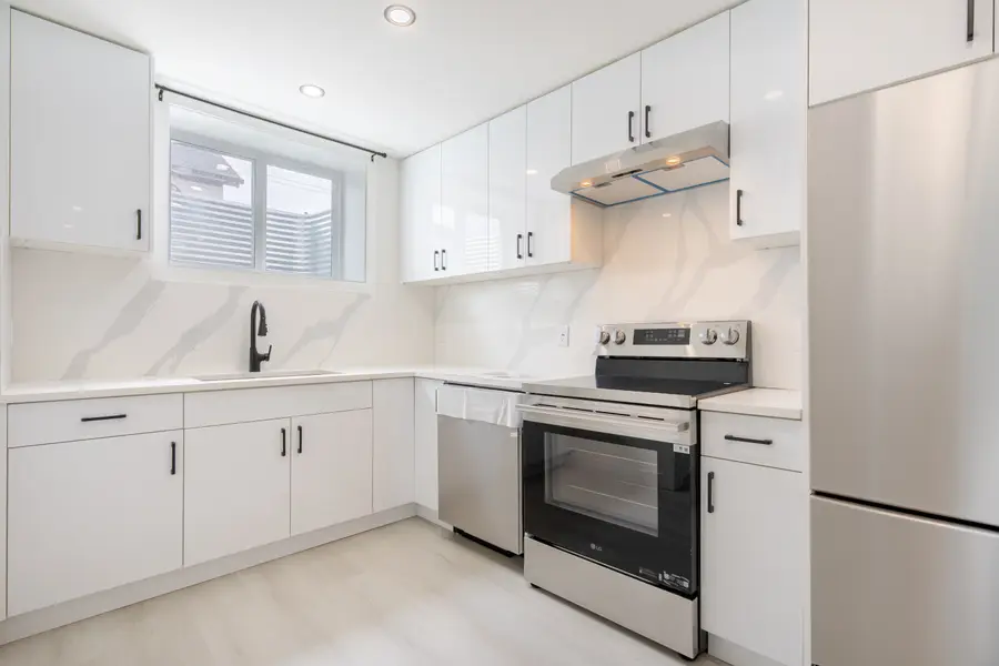 HavenNest legal basement suite interior — brand-new finishes, view 1