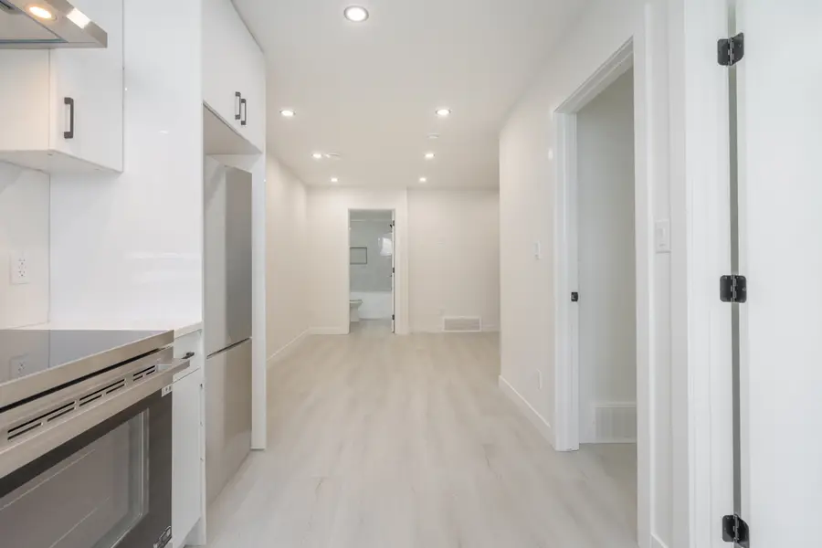 HavenNest legal basement suite interior — brand-new finishes, view 14
